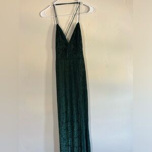 Lucy In The Sky, Green prom dress with pattern and slit.